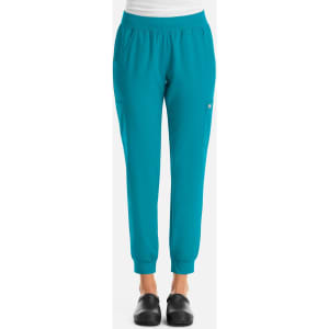 Turquoise jogger pants with an elastic waistband and a fitted cuff at the ankles, featuring a logo on the side.