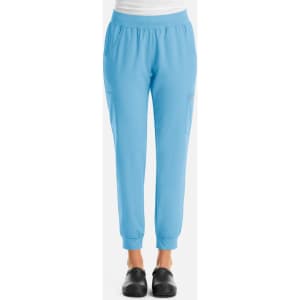 A pair of women's jogger pants in light blue with a fitted ankle and side pockets. The product features a logo.