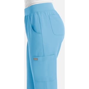A pair of light blue women's jogger pants featuring an elastic waistband and side pockets, with a small logo.