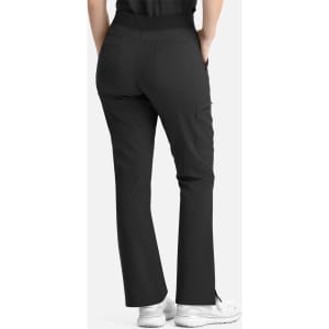 A pair of black women's flare leg pants with a full elastic band and pockets, viewed from the back.