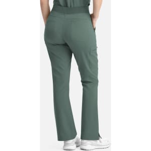 Flare leg pants in a muted green colour, featuring a full elastic band and back pockets. Model shown from behind.
