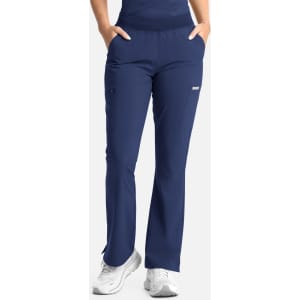 Full elastic band flare leg pant in navy blue with pockets, featuring a logo on the side.