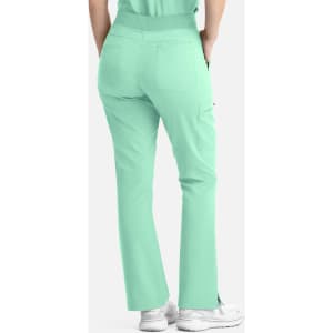 A pair of mint green women's flare leg pants featuring an elastic band and pockets, with a visible logo.