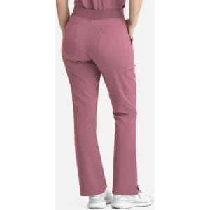 A pair of women's flare leg pants in a rose pink colour, featuring an elastic band and pockets.