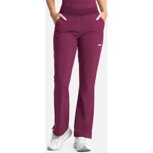 Full elastic band flare leg pant in deep burgundy, featuring pockets and a logo. Suitable for women's activewear.