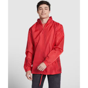 A red waterproof jacket with a zip front, featuring elastic cuffs and a drawstring hem. A logo is visible on the jacket.