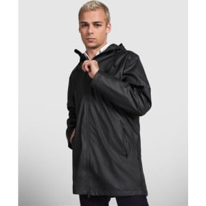 A black waterproof raincoat with a hood, featuring side pockets and a clean design. The model is standing with one hand on the zipper.