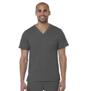 A man wearing a grey V-neck top with a pocket, featuring a logo on the sleeve.