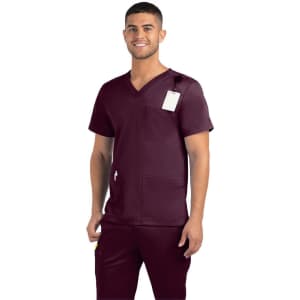 A men’s V-neck top in burgundy with three pockets and a branding logo. An attached tag is visible.