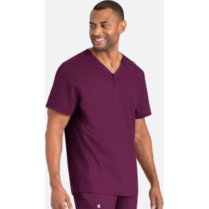 A man in a deep burgundy Henley top with a subtle logo displayed on the side.