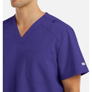 A purple men's V-neck top featuring a pocket and shoulder snap detail, with a logo on the sleeve.