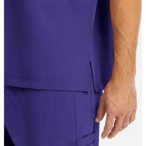 A close-up of a purple men's v-neck top featuring a side split and a hand holding it. The fabric appears smooth.