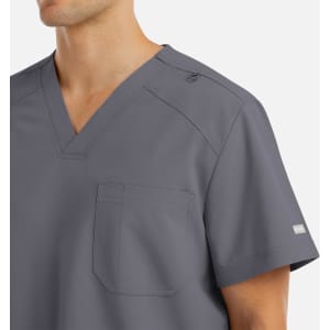 A grey men's v-neck top featuring a chest pocket and a logo on the sleeve.