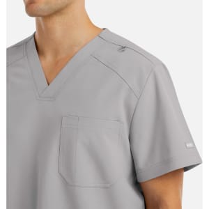 A grey men's v-neck top with a pocket, featuring a logo on the shoulder.