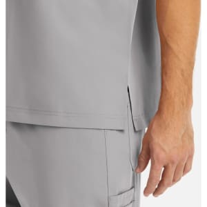 A grey men's tuckable V-neck top with side slits, featuring a close-up of the hem and sleeve.