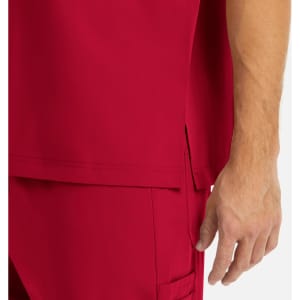 A close-up of a red men's tuckable V-neck top, highlighting the fabric and a seam detail.