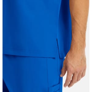 A vibrant blue men's V-neck top with a tuckable design and side slits, featuring a hand in the frame.