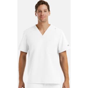 A man wearing a plain white V-neck top with short sleeves and a pocket, featuring a logo on the sleeve.