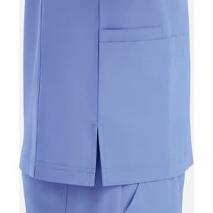 A light blue v-neck top featuring four pockets and side slits for added comfort. Includes a logo.
