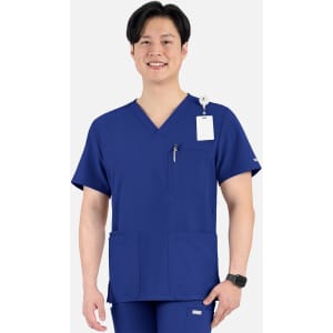 A V-neck top in navy blue with four pockets, featuring a logo and a badge attachment.
