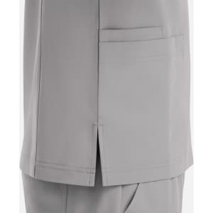 A grey V-neck top featuring four pockets and a side split, designed for ease and comfort. It has a branding logo.