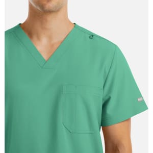 A green v-neck top with four pockets designed for men, featuring a logo on the shoulder.