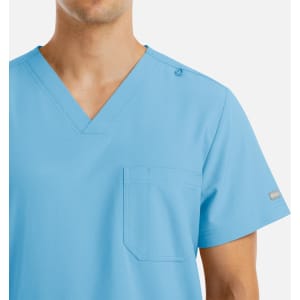 A light blue men's v-neck top with four pockets and a small logo on the shoulder.