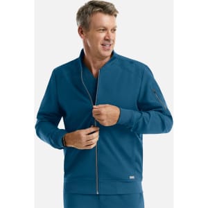 A man wearing a teal full zip bomber jacket with a zippered pocket and a logo on the chest.