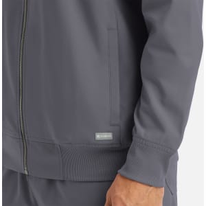 A men's full zip bomber jacket in grey featuring ribbed cuffs and a zip front. It includes a branded logo.