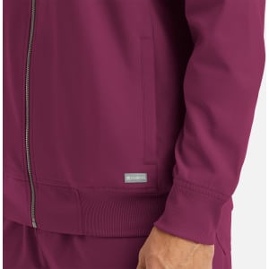 A maroon men's bomber jacket with a full zip, featuring a logo and side pockets.