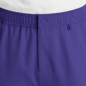 A pair of men's cargo pants in purple with a fly front design and an elastic waistband. Features a button closure.