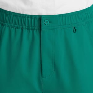 A pair of men's cargo pants in a vibrant teal colour, featuring a fly front and elastic waistband.