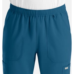 A pair of men's full elastic joggers in a deep blue colour, featuring side pockets and an elastic waistband.
