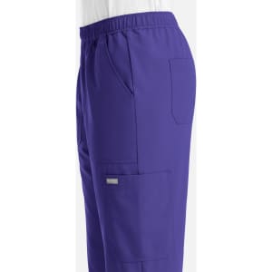A pair of men's joggers in vibrant purple with an elastic waist and multiple pockets. Features a logo branding.