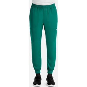 A pair of green full elastic joggers featuring side pockets and fitted cuffs, displayed on a model.