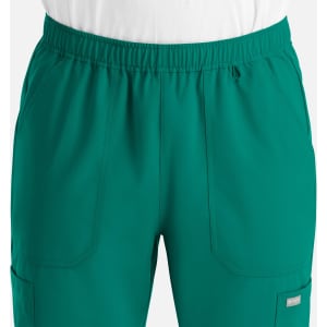 A pair of men's full elastic joggers in a vibrant teal colour, featuring side pockets and an elastic waistband.