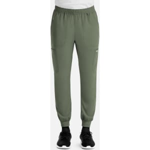 A full elastic jogger in olive green, featuring side pockets and elastic cuffs, paired with black sneakers.