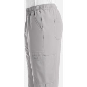 A side view of grey men's joggers with an elastic waistband and multiple pockets. The design features a logo.