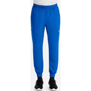 A pair of blue men's joggers featuring a full elastic waistband and side pockets, worn with black sneakers.