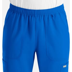 A pair of men's joggers in vibrant blue, featuring an elastic waistband and practical pockets.