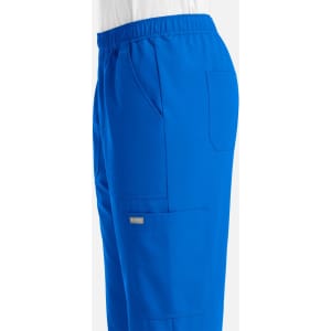 A pair of blue full elastic joggers with pockets and an elastic waistband. Features a branding logo.