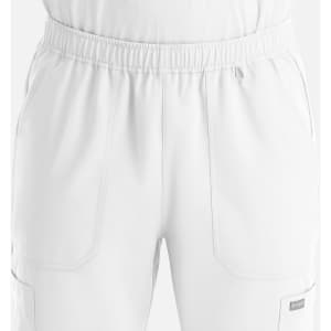 A pair of white full elastic joggers with pockets and an elastic waistband, featuring a small logo.
