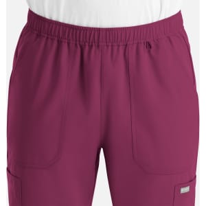 A pair of men's full elastic joggers in a rich berry colour, featuring front pockets and a drawstring waist.