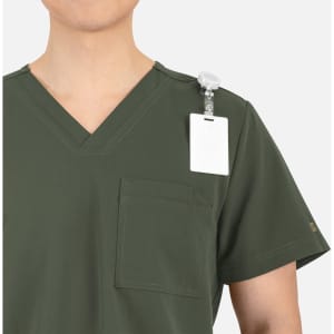 A men's V-neck top in dark green with a chest pocket and a clip-on tag on the shoulder. Features a logo on the sleeve.