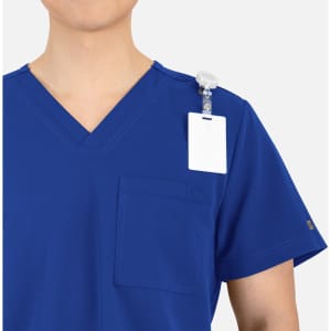 A blue V-neck top featuring contrast piping, a pocket, and a clip-on badge holder.