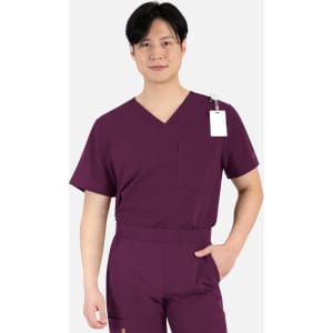 A male model in a burgundy V-neck top featuring a chest pocket and a tag. The fabric appears lightweight and comfortable.