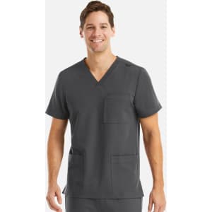 A men's v-neck top in grey featuring three pockets and a logo. The model is smiling while wearing the top.