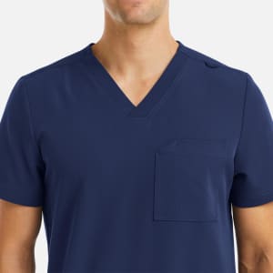 A men's navy V-neck top featuring three pockets and a logo.
