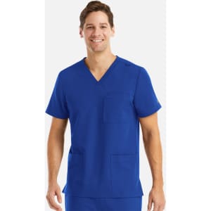 A man is wearing a vibrant blue v-neck top with three pockets. The top has a logo on it.