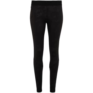 Black training leggings with a sleek design, featuring a subtle pattern and a logo on the waistband.
